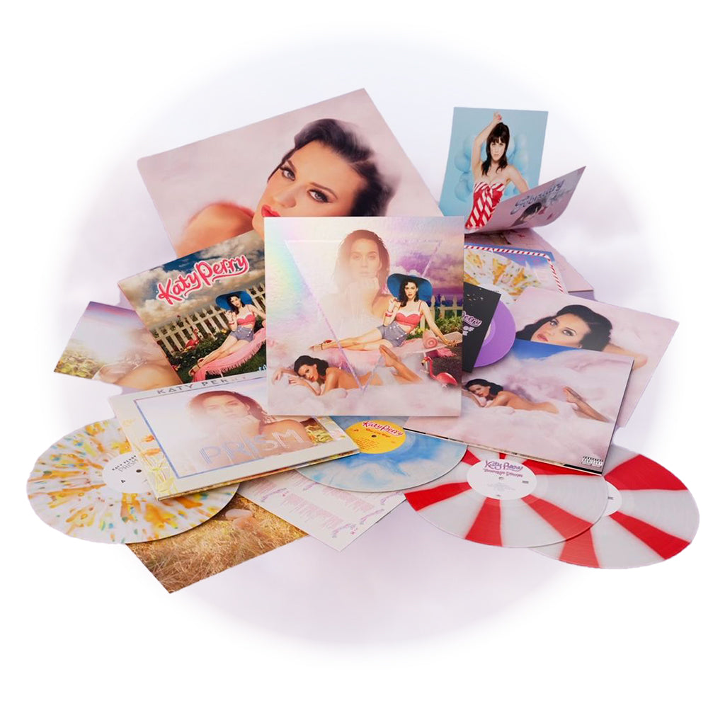 Tutto il contenuto del box set Katy CATalog: 5 LP Colorati che contengono gli iconici album One Of The Boys, Teenage Dream, Prism,un 45 giri Colorato, Inserti Fotografici Esclusivi, Poster Calendario 2024, Photobook di 12 pagine