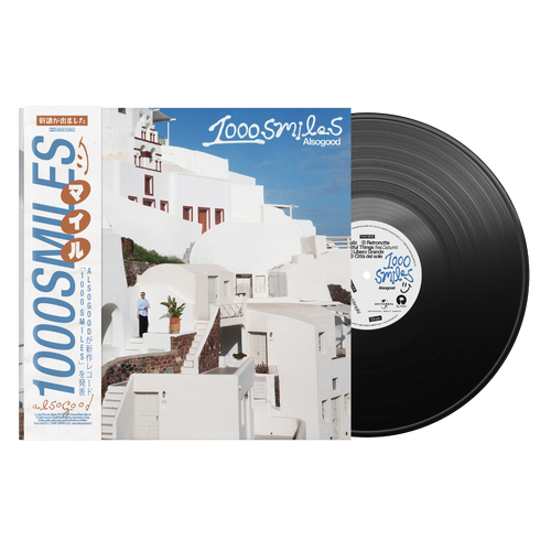 1000 Smiles Alsogood vinile LP nero con OBI edition disco in evidenza e copertina con architettura bianca mediterranea e cielo blu