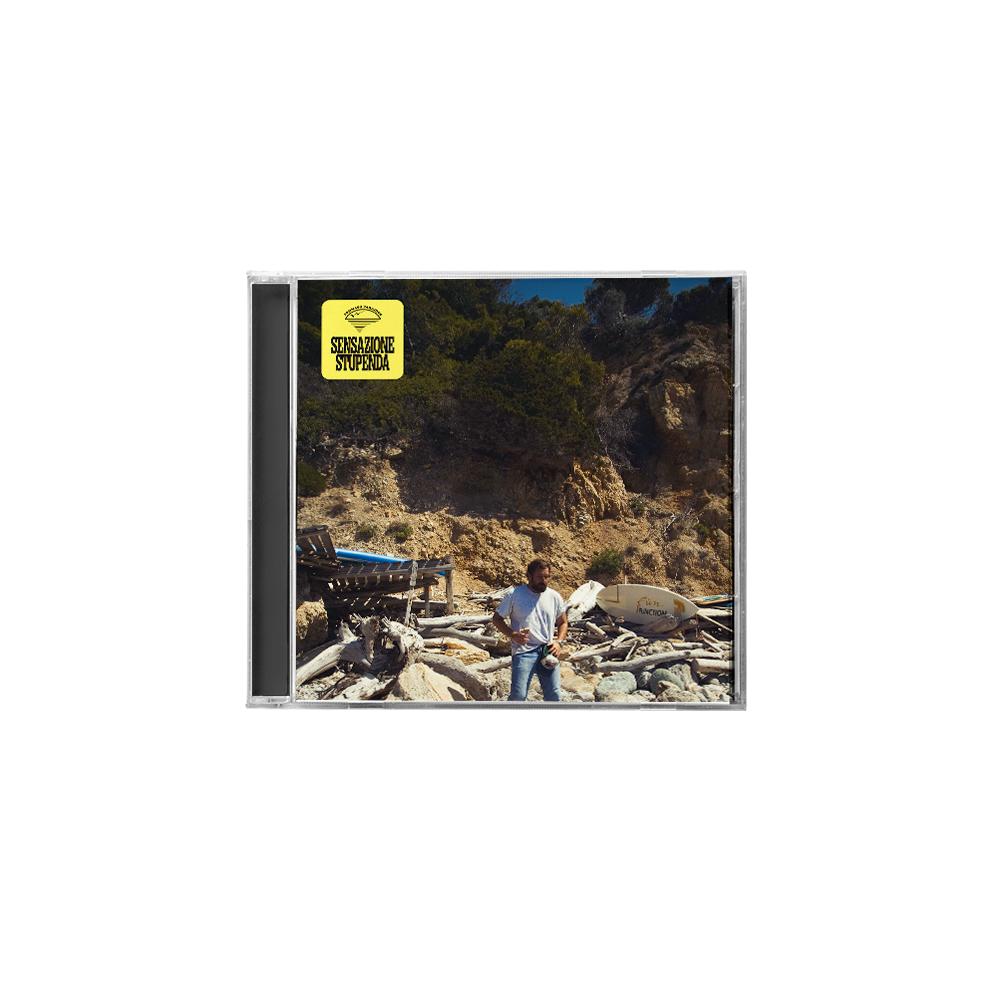 CD SENSAZIONE STUPENDA ALBUM DI TOMMASO PARADISO CON UOMO IN PIEDI E SFONDO CON SASSI ROCCE E ALBERI