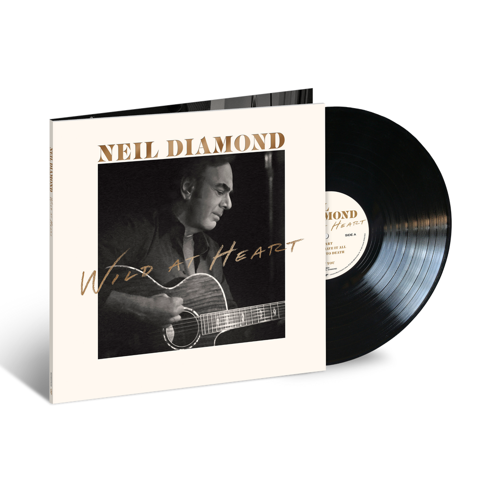 Neil Diamond – Wild at Heart vinile LP nero, copertina con ritratto in bianco e nero dell’artista mentre suona la chitarra, titolo dorato su sfondo chiaro.