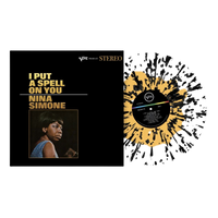 vinile i put a spell on you di nina simone coprtina nera con foto della cantante e disco in vinile in vista effetto splatter colorato trasperente giallo e nero